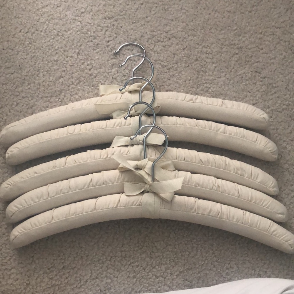 Seven canvas padded hangars